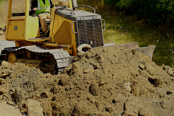 Construction site preparation using a bulldozer.